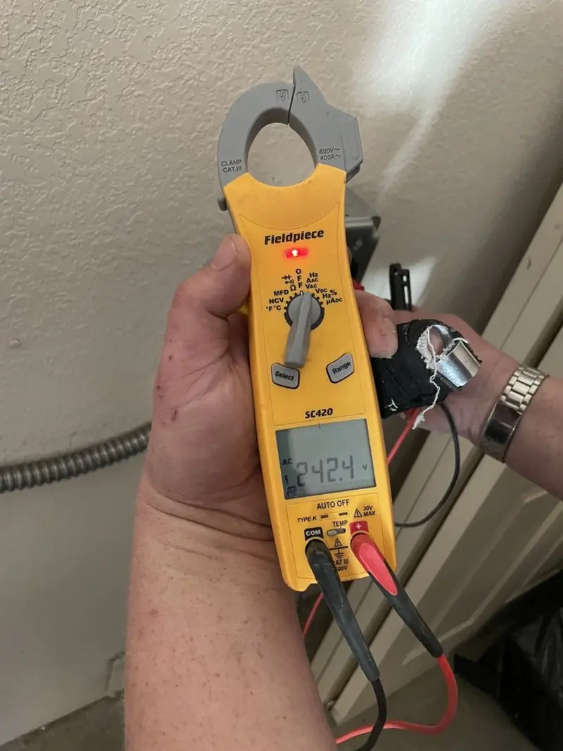 Voltage testing with clamp meter during Generator Installation in Portland